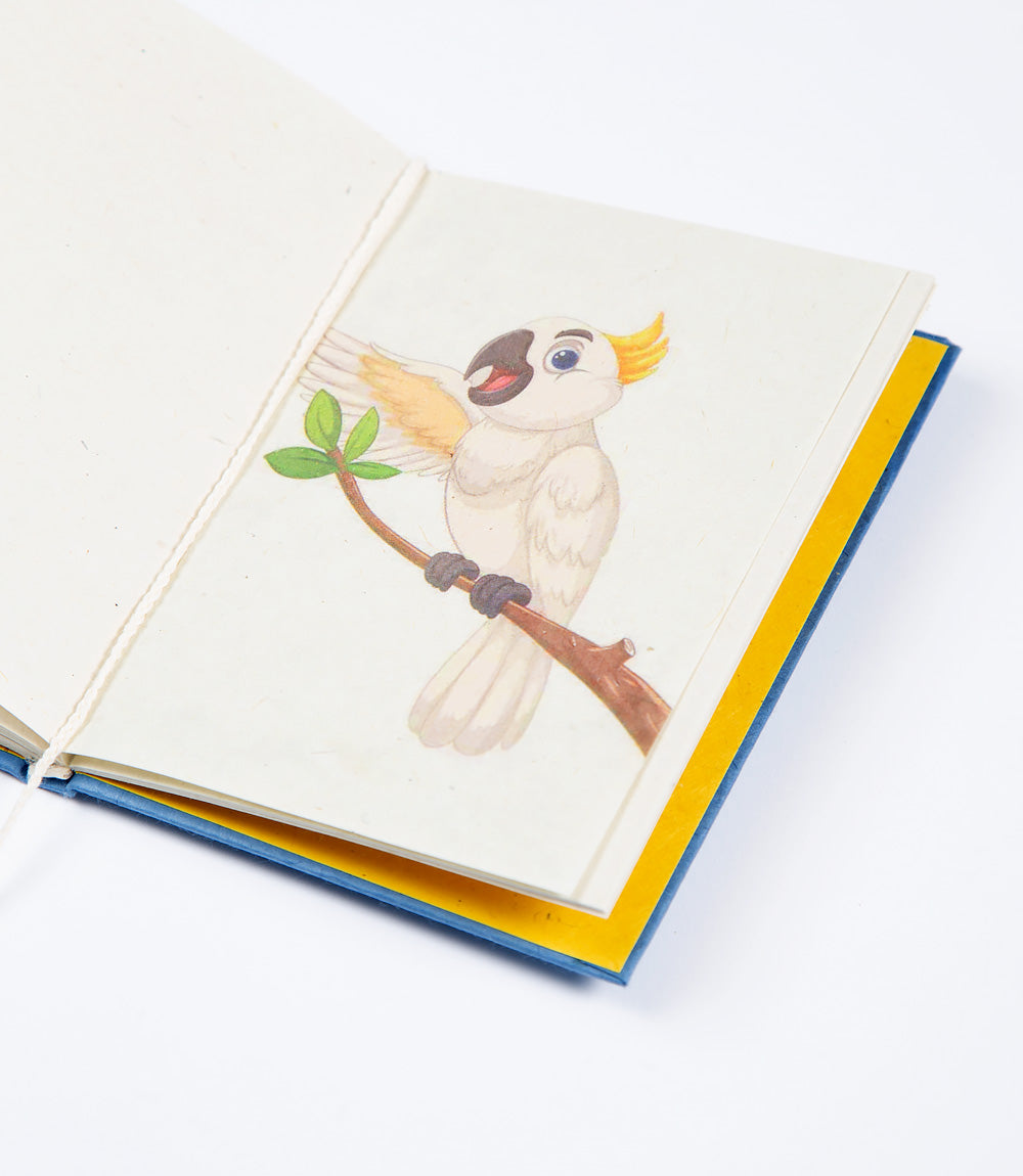 Open notebook with a cartoon parrot illustration on a white background