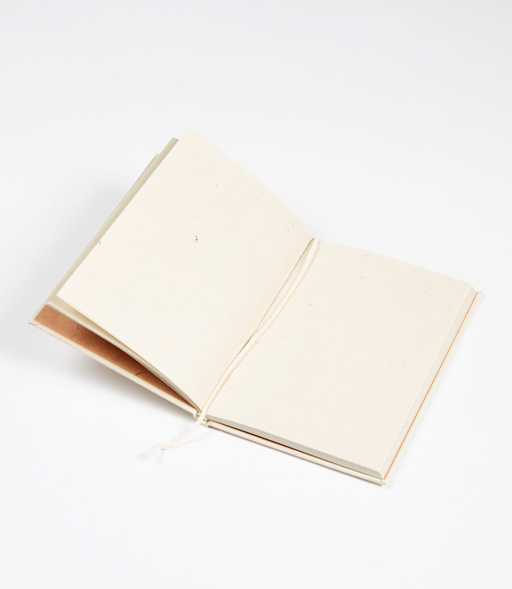 Open notebook with blank pages on a white background