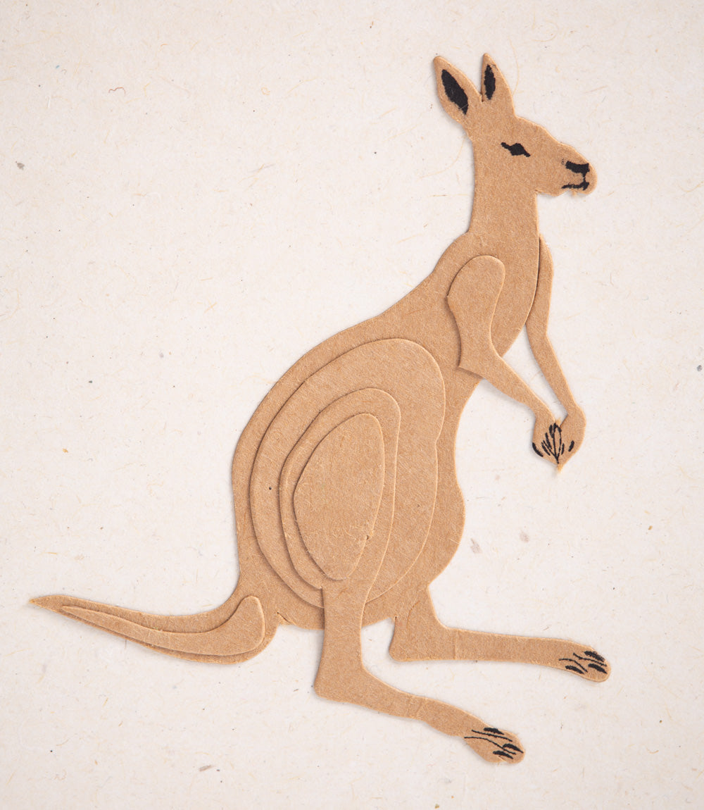 Cardboard cutout of a kangaroo on a beige background
