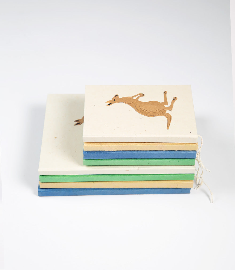 Stack of colorful books with a kangaroo illustration on a white background