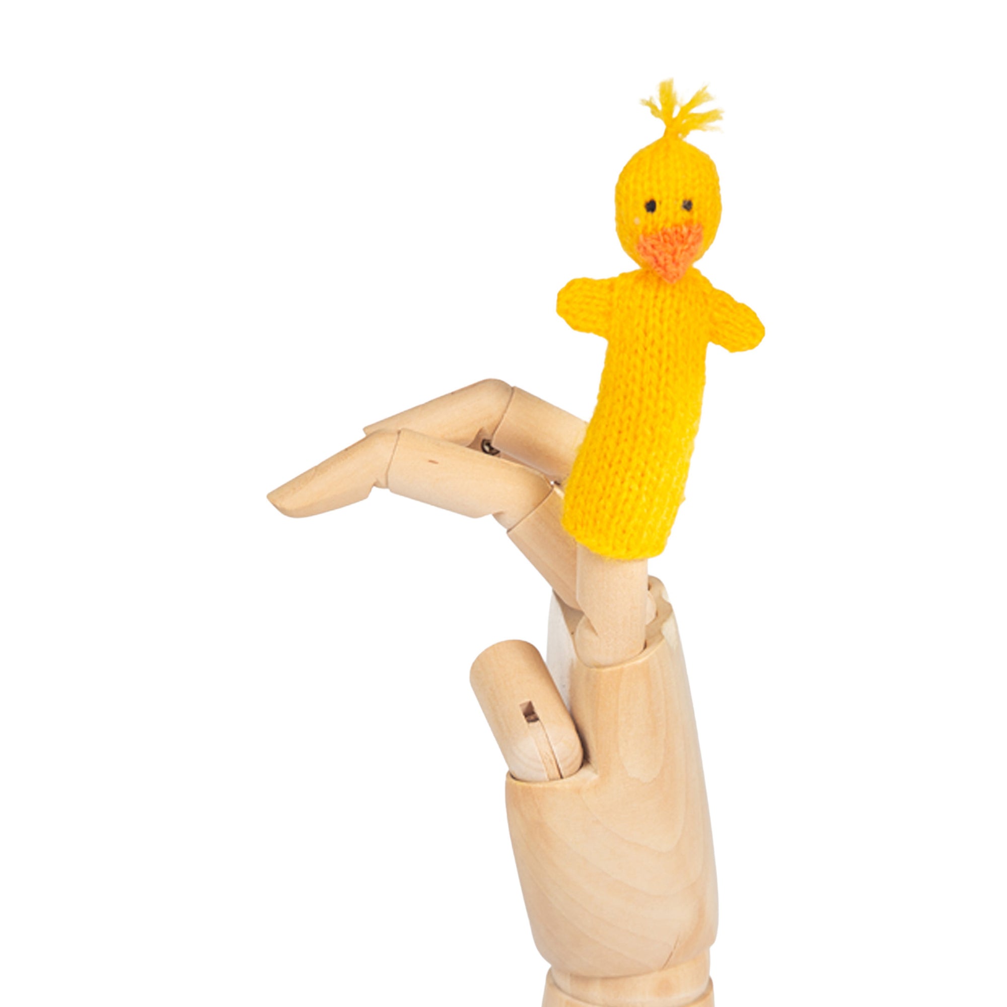 Yellow knitted finger puppet on a wooden mannequin hand against a white background
