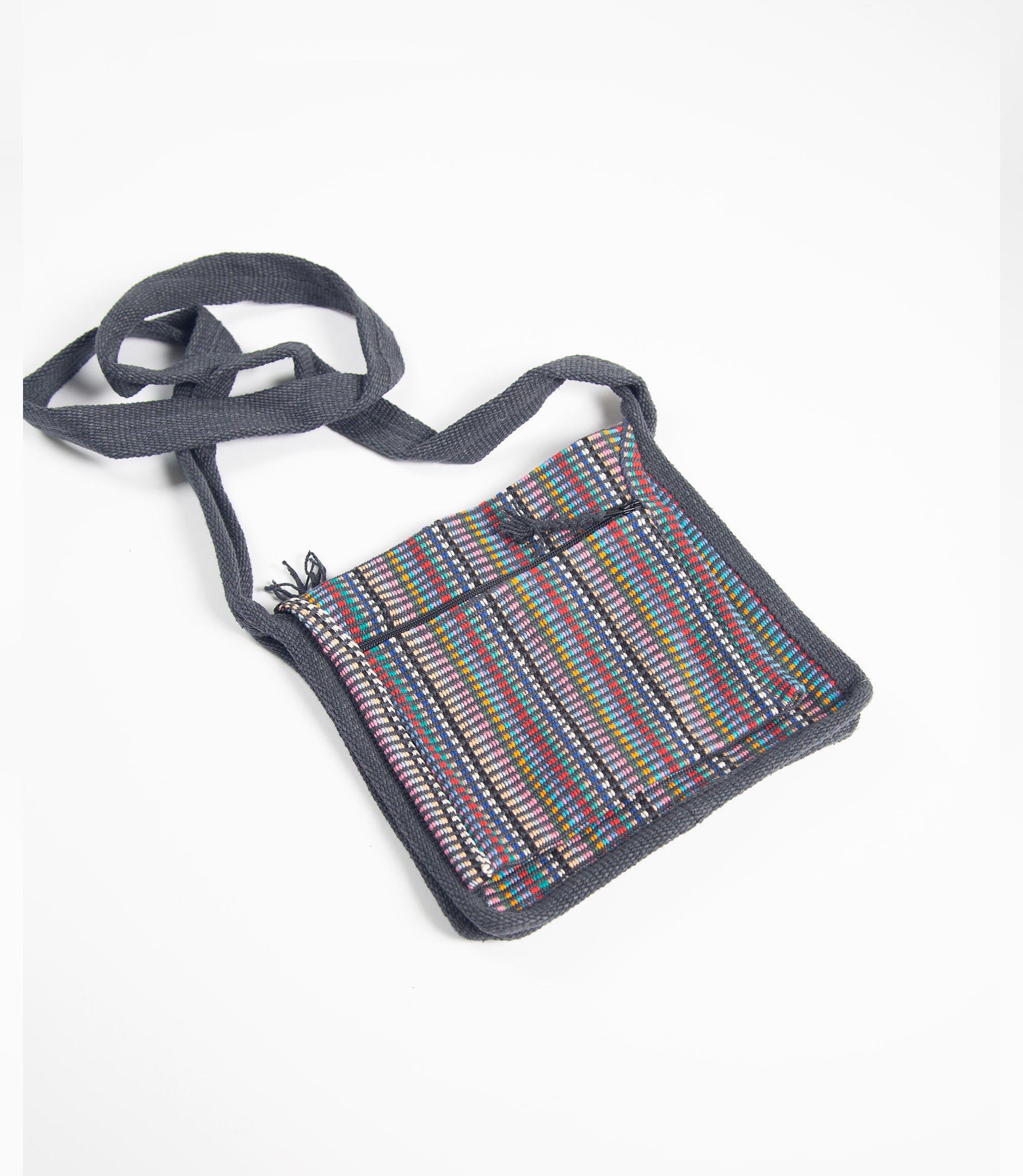 Small square bag with a colorful striped pattern on a white background
