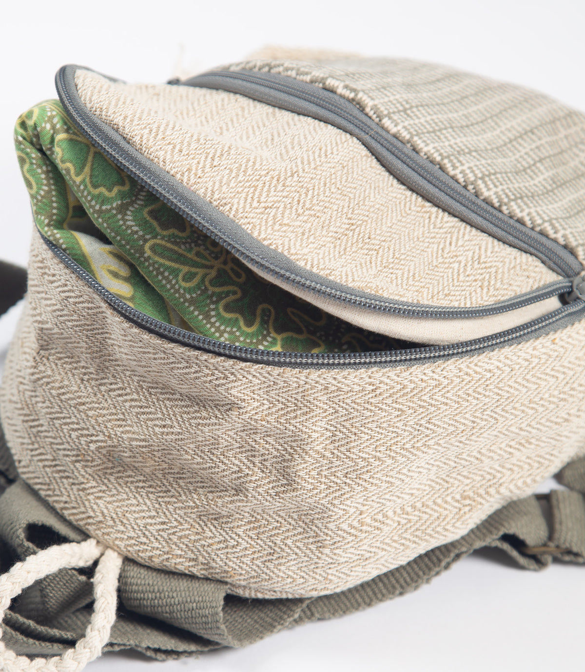 Textured bag with a picnic rug inside on a white background
