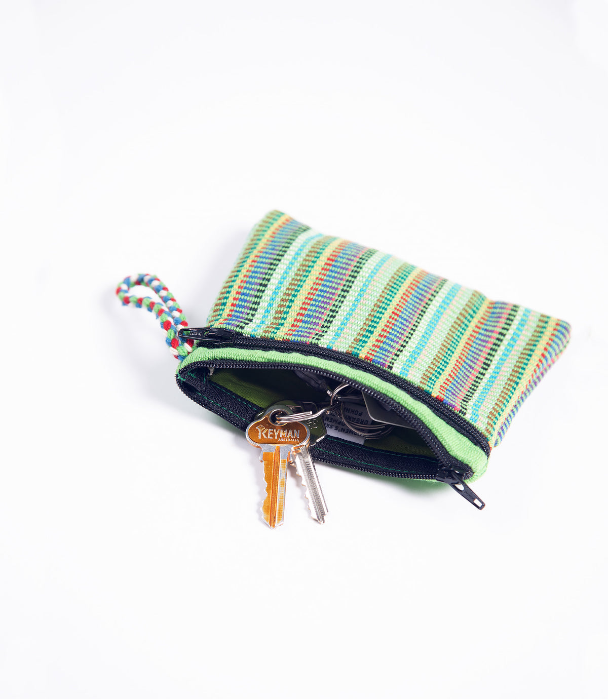 Multicolored striped key pouch with keys on a white background