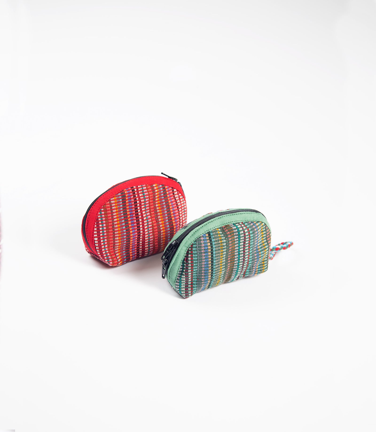 Two colorful striped key purses on a white background