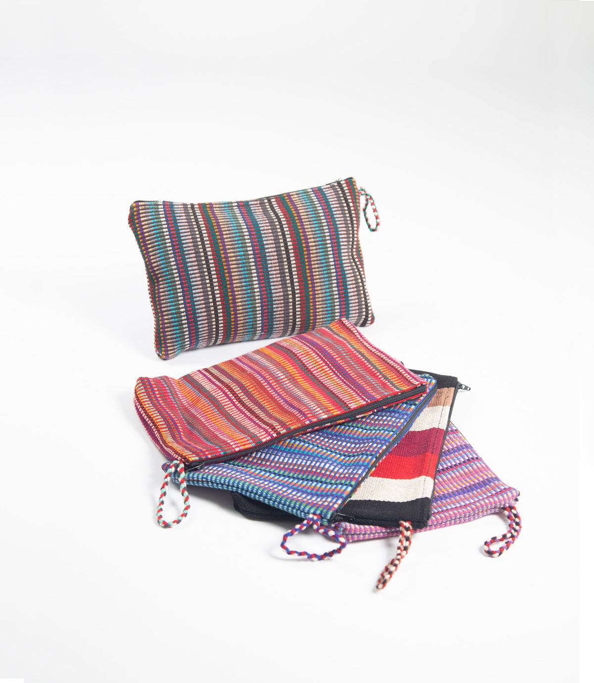 Colorful striped pouches on a white background