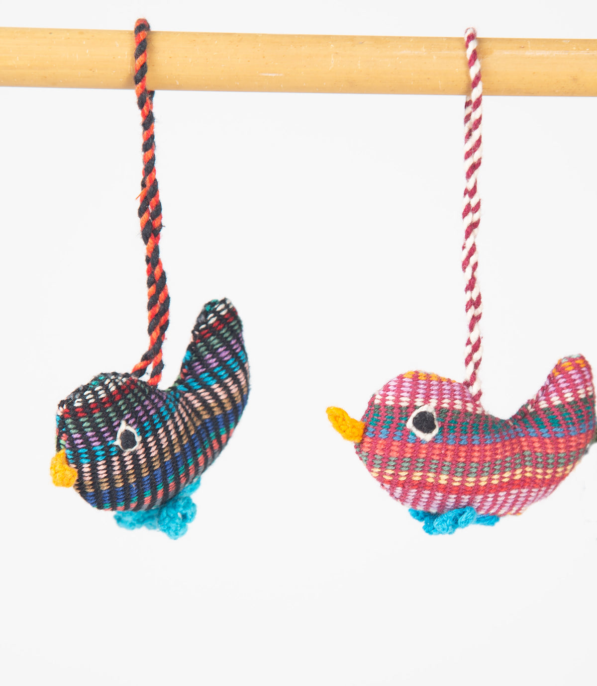 Colorful bird-shaped hanging toys close-up
