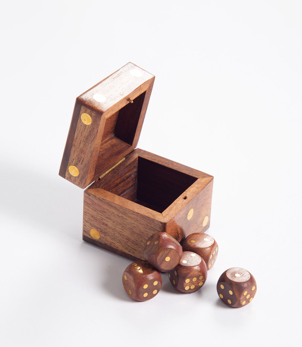 Wooden box with dice on a white background