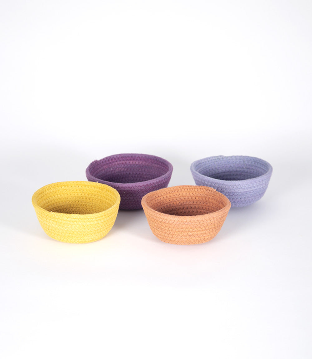 Set of small cotton bowls in pastel colours.