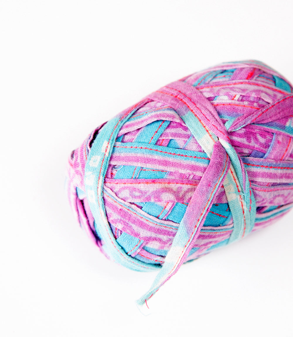 Upcycled saree ribbon in different colours. The ribbon is folded and stitched.