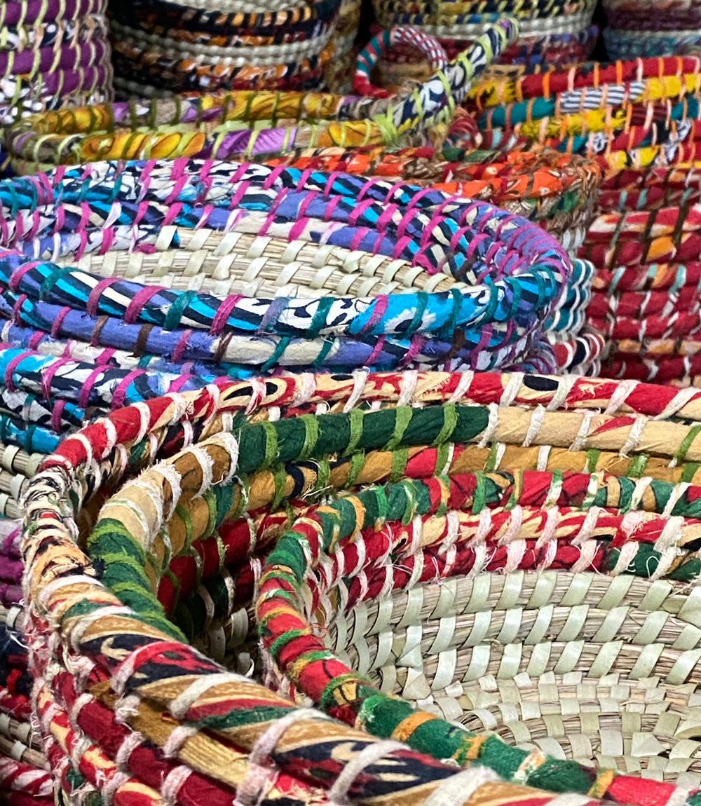 Colourful upcycled saree strings on baskets bringing uniqueness