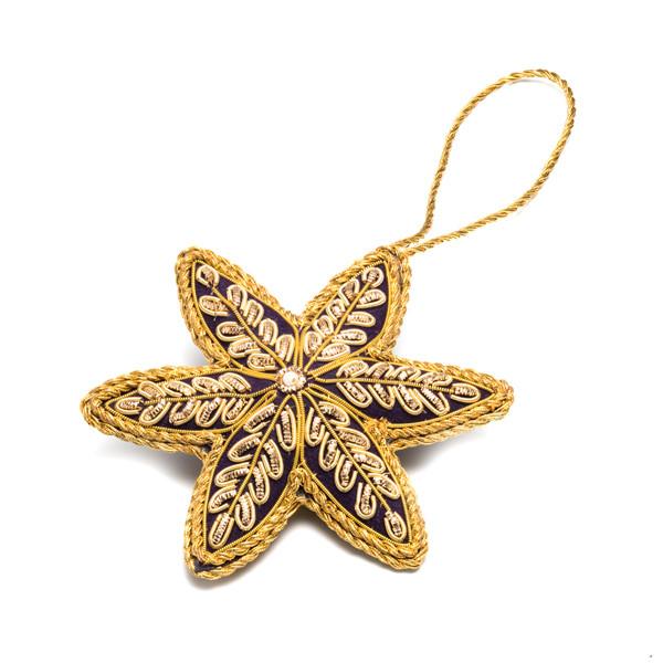 Small embroidered star decoration. 