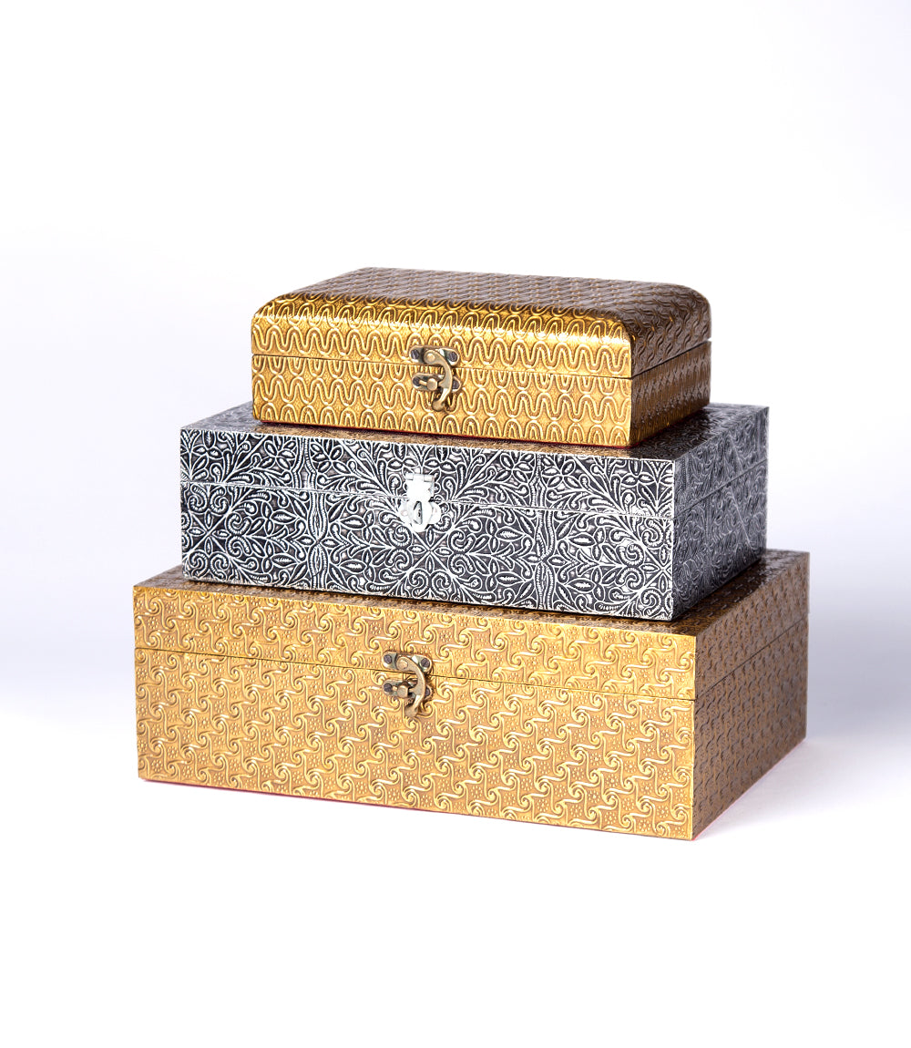 Three brass metal boxes